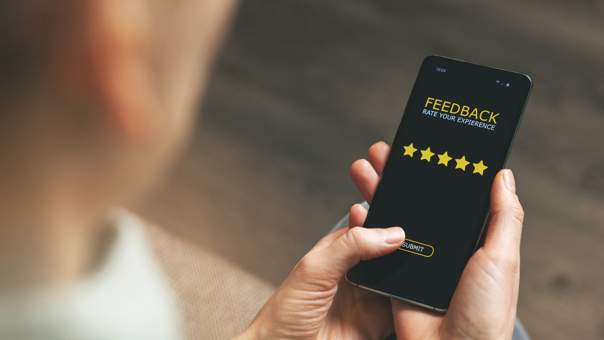 A man writing a review to get more reviews for your business.