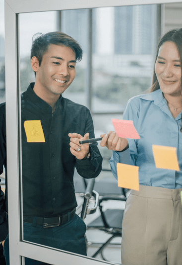 Business people collaborating in an office, brainstorming