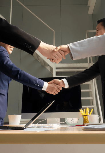 A group of people shaking hands in agreement