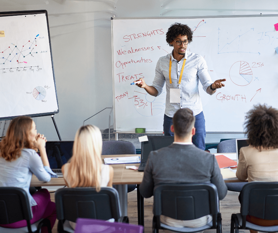 man standing and teaching