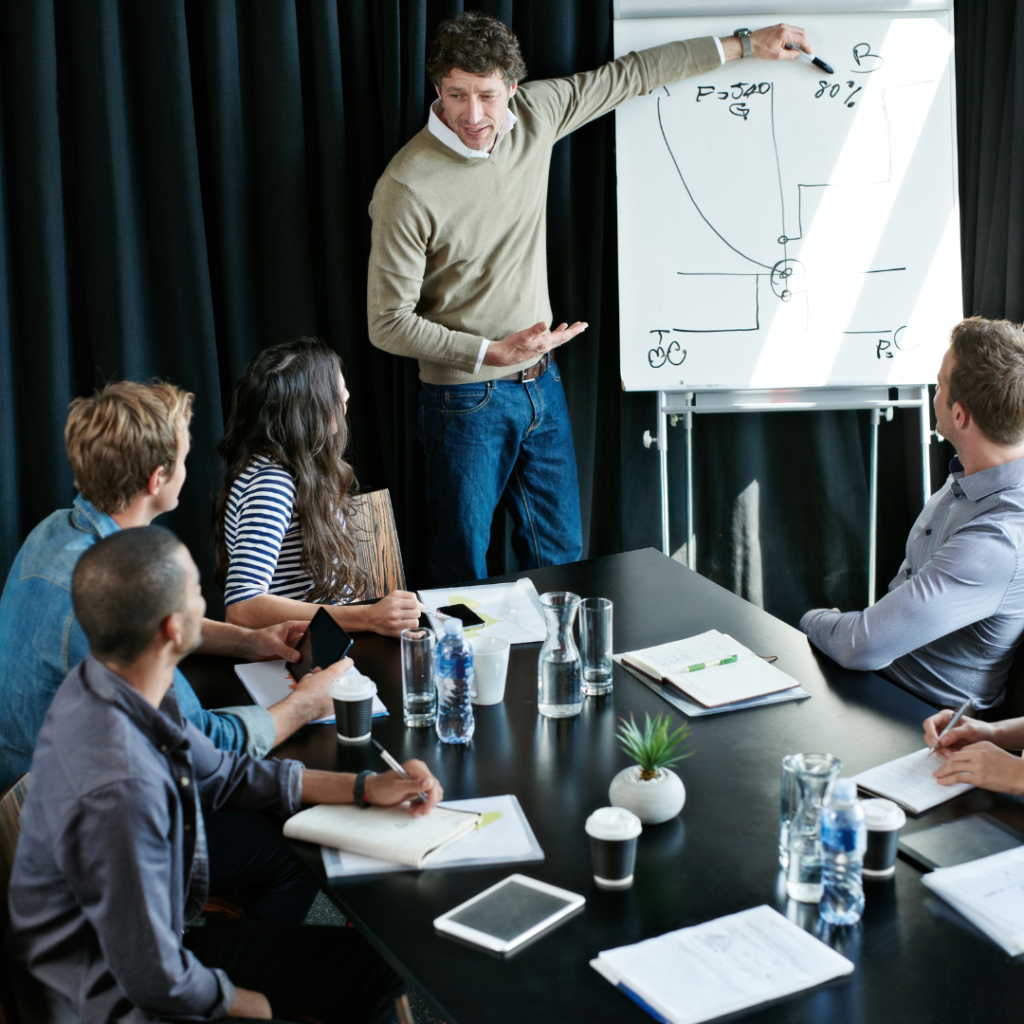 A man giving a presentation on strategic planning, explaining its importance and benefits.